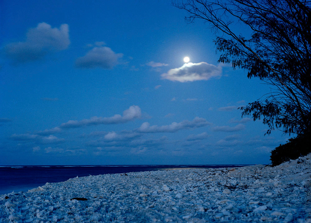 Landscape Moon over stoney beach